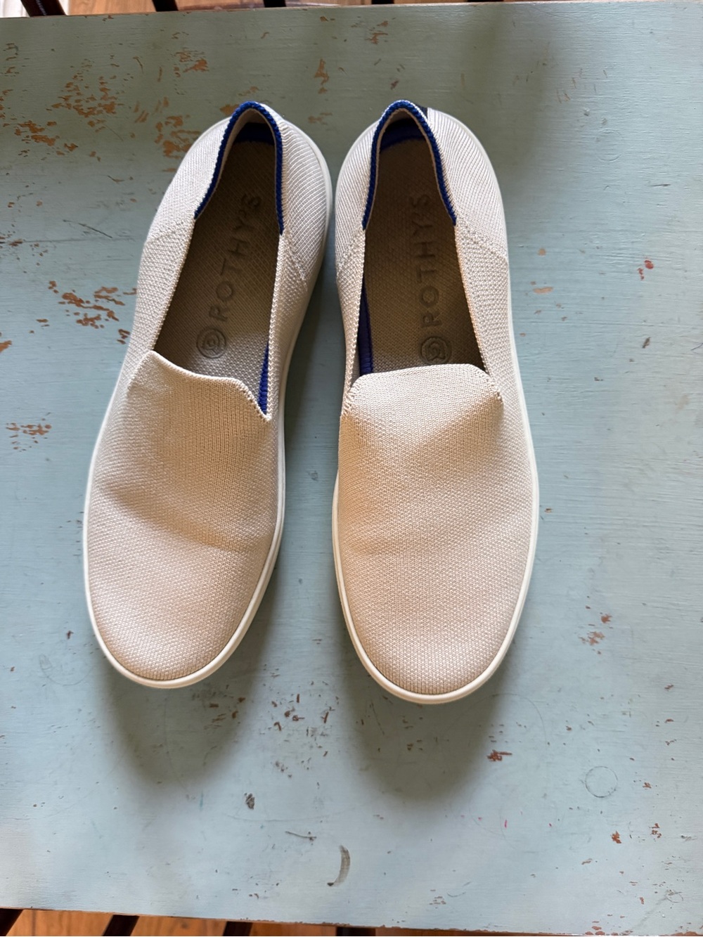 Rothy's Slip-On Sneakers in Light Beige with Blue Accent